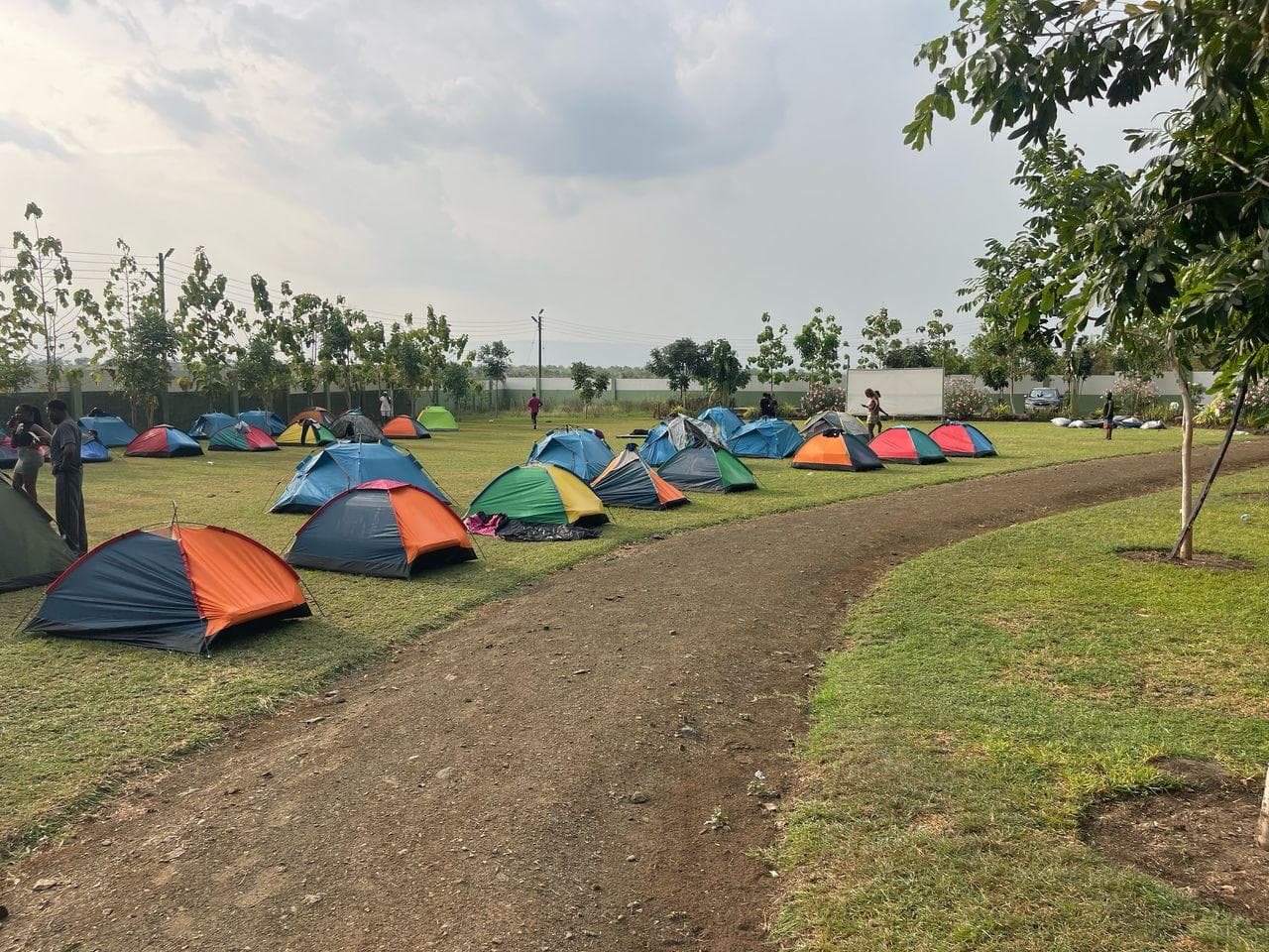 Colourful tents on green lawn during the day