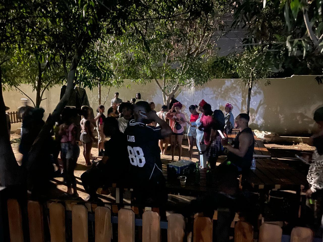 People socializing at poolside area